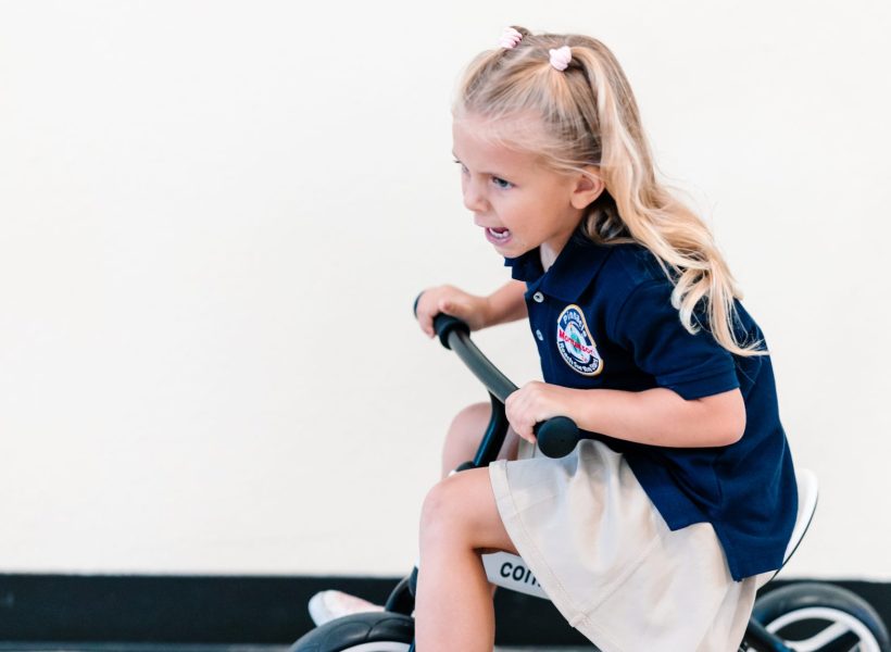 A student at Pinnacle Montessori of Alliance is cycling around.