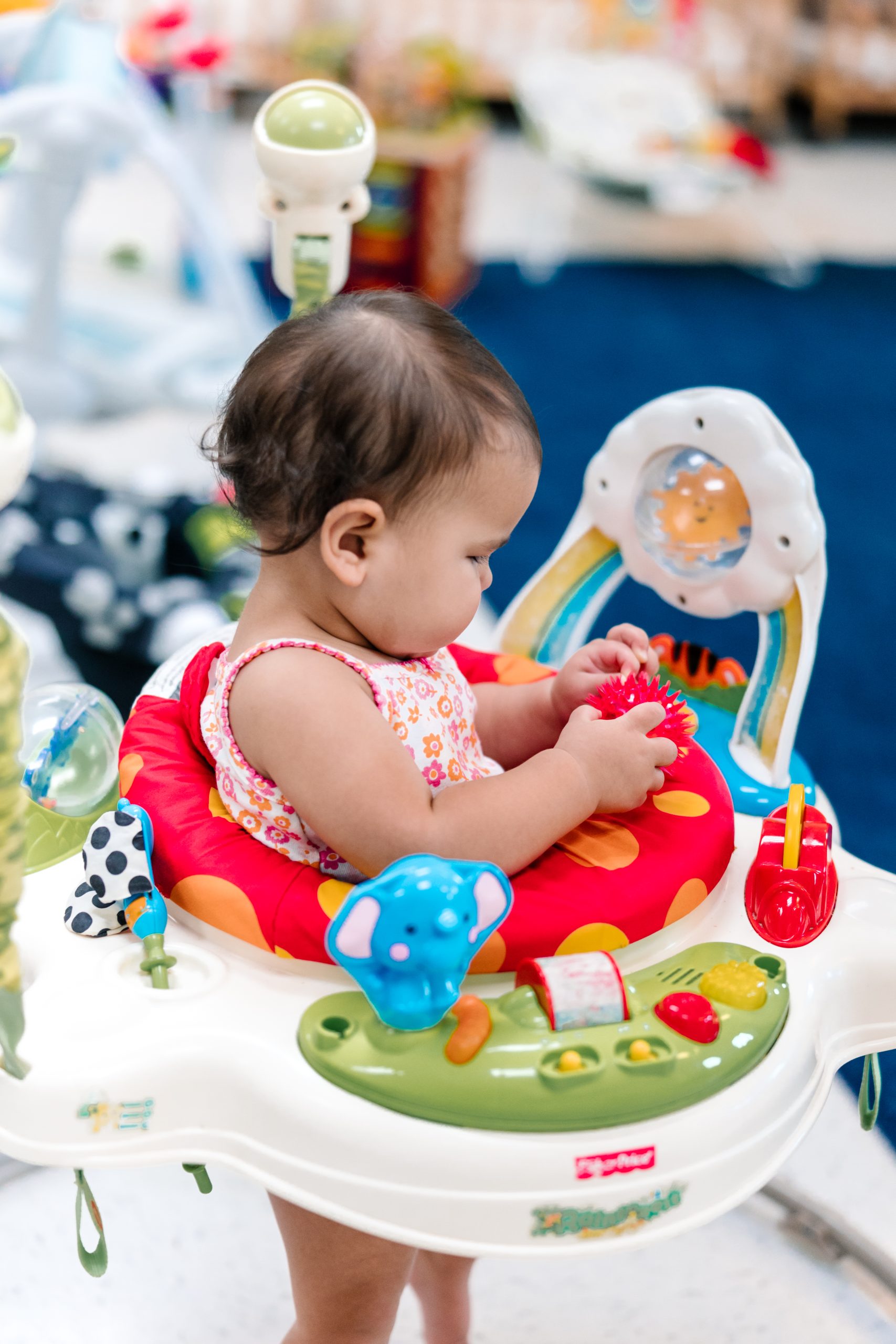 infant at pinnacle montessori learning motor skills with the help of walker