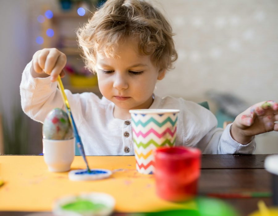 Cute Toddler Painting Easter Eggs
