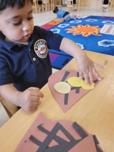 A kid is engaged in learning with the Montessori method at Pinnacle Montessori of Schertz.