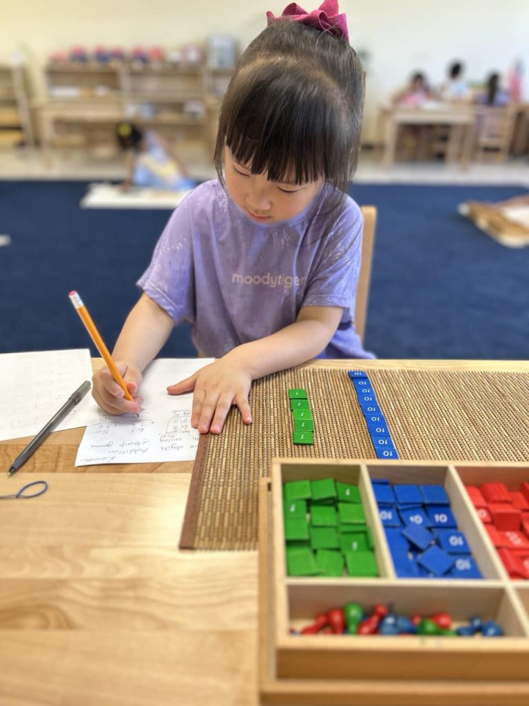 A young learner at Pinnacle Montessori of Schertz is participating in hands-on activities.