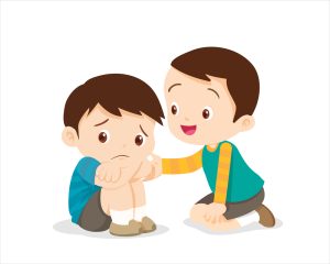 A sad child is being comforted by his friend. Children consoling a sad friend against an isolated background.
